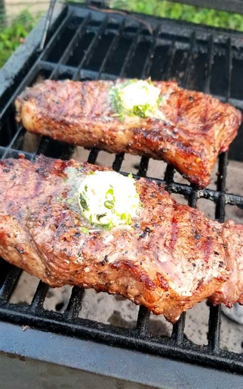 grilled-rib-eye-steaks-with-roasted-garlic-herb-butter image