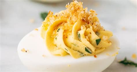 italian-deviled-eggs-with-garlic-and-basil-striped-spatula image
