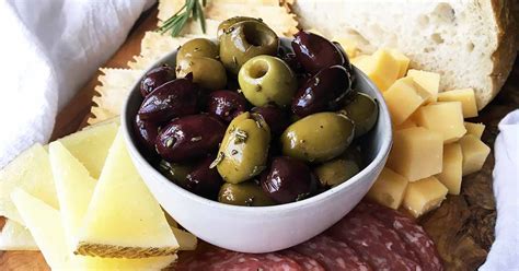 garlic-and-fresh-herb-roasted-olives-recipe-foodal image