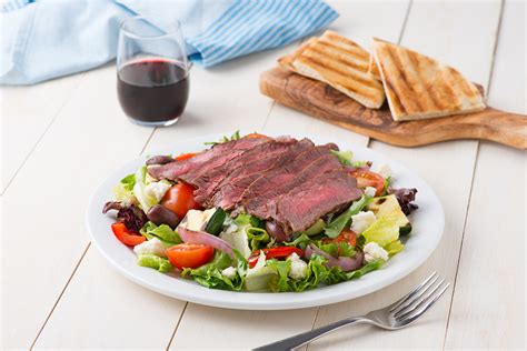 grilled-greek-salad-with-steak-meat-poultry image