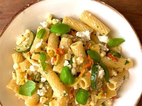 zucchini-feta-and-squash-blossom-pasta-food-network image