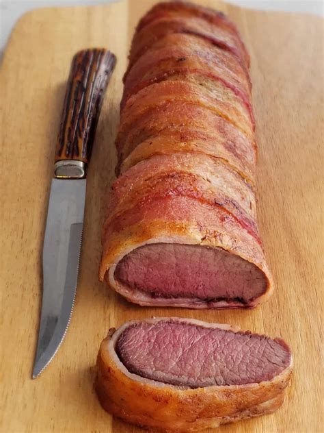 bacon-wrapped-venison-backstrap-roast-grits-and-gouda image