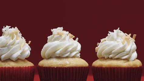 vanilla-bean-coconut-cupcakes-with-frosting image