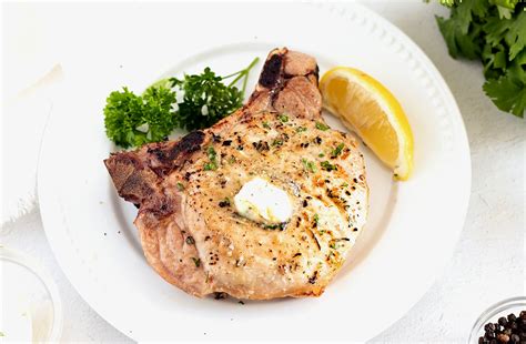 the-best-smoked-pork-chops-with-garlic-herb-butter image