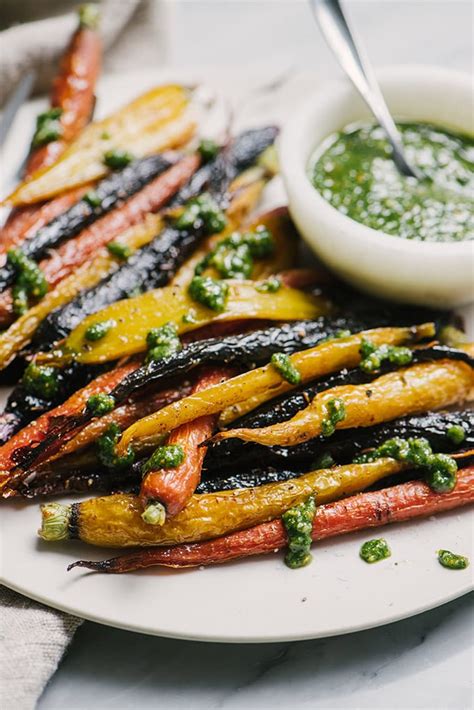 honey-roasted-carrots-with-cumin-and-carrot-top-pesto image