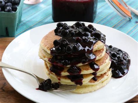 fluffy-lemon-ricotta-pancakes-with-blueberry-sauce image