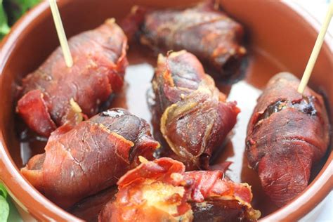 prosciutto-wrapped-dates-with-goats-cheese-delicious image