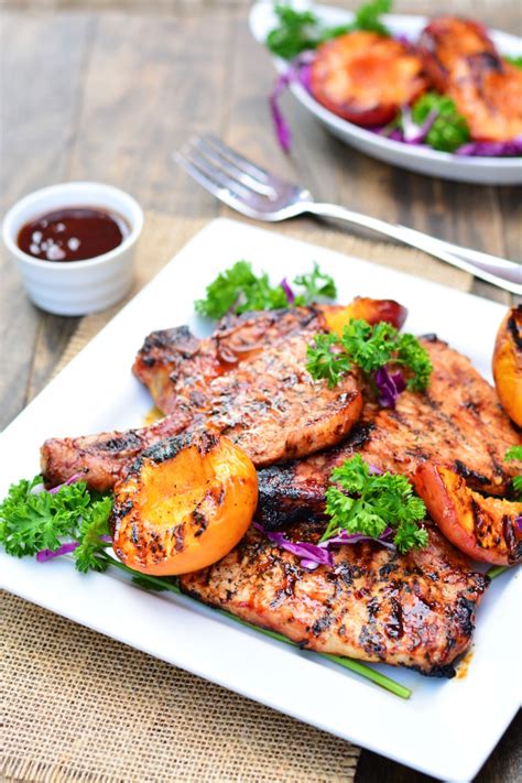 barbecue-pork-chops-with-grilled-peaches-garnish image