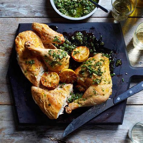 roast-chicken-with-salsa-verde-and-roasted-lemons image
