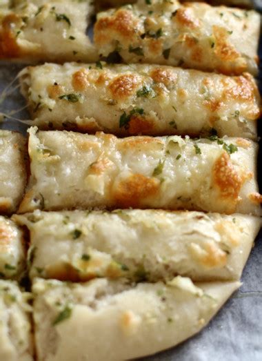 cheesy-garlic-breadsticks-with-homemade-pizza-dough image