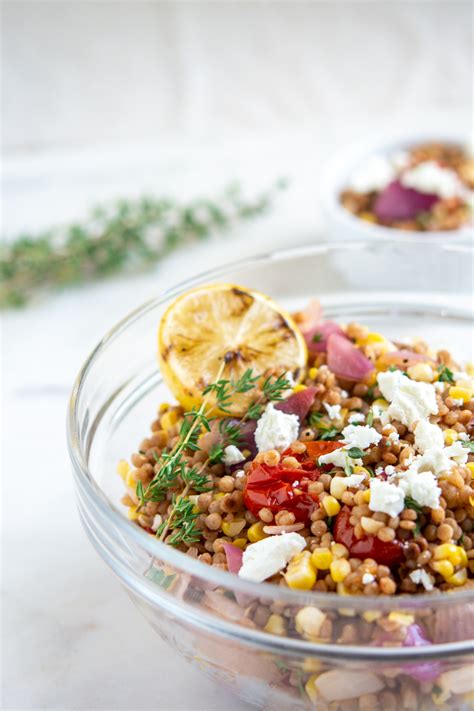 israeli-couscous-tomato-and-corn-salad-with-goat-cheese image