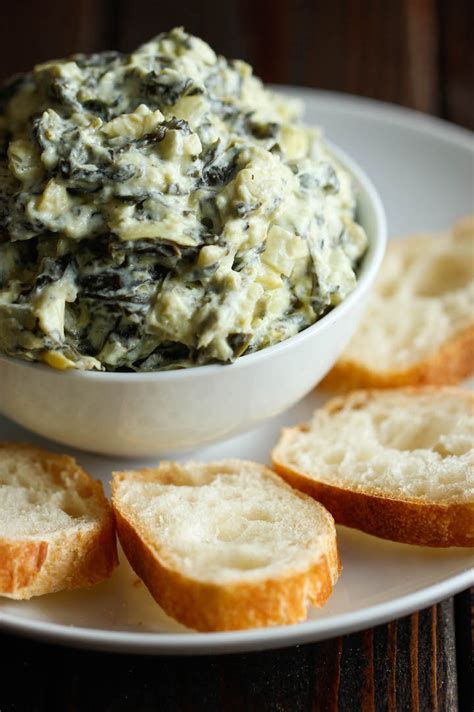 slow-cooker-spinach-and-artichoke-dip-damn-delicious image
