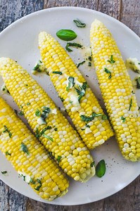 herb-buttered-corn-on-the-cob-recipe-how-to-video image