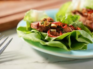spicy-pork-loin-and-lettuce-wraps-food-network image